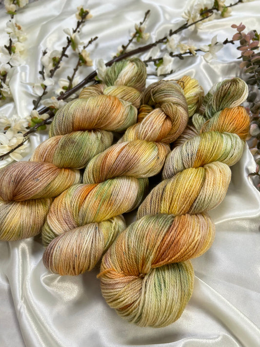 custom orange, moss green, gold, sepia brown variegated hand dyed yarn on superwash merino fingering weight