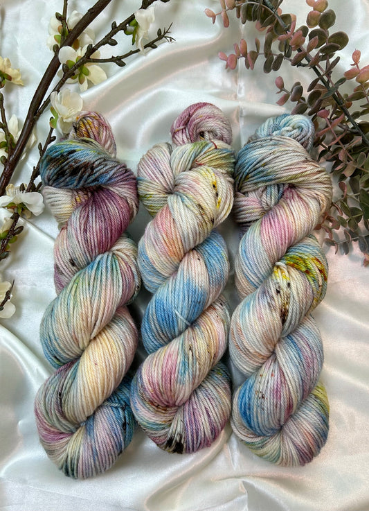 custom orchid pink, mauve, blue, cream variegated hand dyed with fawn brown speckles on superwash merino dk weight